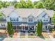 Beautiful aerial view of the townhomes showing the well-kept landscaping, front porches, and ample parking at 11218 Grass Field Rd # 1083, Charlotte, NC 28213