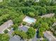 Overhead shot of community pool, parking, and surrounding trees, offering a serene living experience at 11218 Grass Field Rd # 1083, Charlotte, NC 28213