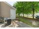 Cozy backyard featuring well-maintained grass and a patio area ideal for outdoor relaxation and entertainment at 11218 Grass Field Rd # 1083, Charlotte, NC 28213