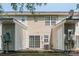 The backyard of the house features two storage units and a sliding glass door at 11218 Grass Field Rd # 1083, Charlotte, NC 28213