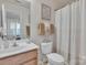 Bright bathroom features a decorative vanity and a shower with a curtain, perfect for a clean and functional space at 11218 Grass Field Rd # 1083, Charlotte, NC 28213