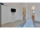 Bedroom featuring closets, tv, and ensuite bathroom at 11218 Grass Field Rd # 1083, Charlotte, NC 28213