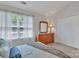 Bright bedroom with dresser, closet, neutral decor, and natural light at 11218 Grass Field Rd # 1083, Charlotte, NC 28213