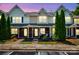 Charming townhome with brick accents, landscaped front yard, and inviting entrance at 11218 Grass Field Rd # 1083, Charlotte, NC 28213