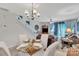 Inviting living room features a glass-top dining table and staircase at 11218 Grass Field Rd # 1083, Charlotte, NC 28213