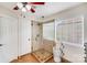 Bright bathroom featuring a shower and a window for natural light at 11714 Harsworth Ln, Charlotte, NC 28277