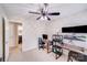 Bright bedroom with neutral carpet and paint, features a ceiling fan and an ensuite bathroom at 11714 Harsworth Ln, Charlotte, NC 28277