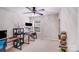 Bedroom featuring neutral carpet, a ceiling fan, and a window providing natural light at 11714 Harsworth Ln, Charlotte, NC 28277