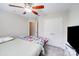 Cozy bedroom with a ceiling fan, closet and a large window providing natural light at 11714 Harsworth Ln, Charlotte, NC 28277