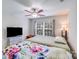 Bedroom with a ceiling fan and large window offering plenty of natural light and closet space at 11714 Harsworth Ln, Charlotte, NC 28277