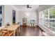 Dining area featuring hardwood floors, a ceiling fan, and a large window at 11714 Harsworth Ln, Charlotte, NC 28277