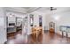 Spacious open-concept living and dining area with hardwood floors and natural light at 11714 Harsworth Ln, Charlotte, NC 28277