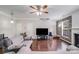 Bright living room with fireplace, hardwood floors, and natural light at 11714 Harsworth Ln, Charlotte, NC 28277