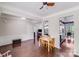 Open living space with hardwood floors, crown molding, and a view into the kitchen at 11714 Harsworth Ln, Charlotte, NC 28277