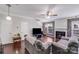 Cozy living room features hardwood floors, fireplace, and ample seating at 11714 Harsworth Ln, Charlotte, NC 28277