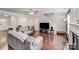 Inviting living room with hardwood floors, fireplace, and comfortable seating at 11714 Harsworth Ln, Charlotte, NC 28277