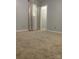 Bedroom with plush carpet, neutral paint, and large windows, offering a calm and inviting space at 120 Booker St, Wingate, NC 28112