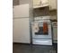 Kitchen with stainless steel appliances and white cabinets for modern appeal at 120 Booker St, Wingate, NC 28112