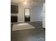 Open concept kitchen with updated cabinets, white appliances, and a large area rug at 120 Booker St, Wingate, NC 28112
