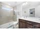 Modern bathroom featuring a glass-enclosed shower, neutral tile, and stylish vanity with ample counter space at 1201 Township Pkwy, Belmont, NC 28012