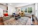 Airy living room featuring neutral tones, abundant natural light, and a comfortable seating arrangement at 1201 Township Pkwy, Belmont, NC 28012