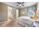 Relaxing bedroom with a ceiling fan, large window providing natural light and neutral tones creating a peaceful ambiance at 1284 Independence St, Fort Mill, SC 29708