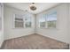 Clean bedroom with neutral paint, carpet, bright windows, and ceiling fan at 1284 Independence St, Fort Mill, SC 29708