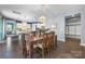 Dining room featuring a large wooden table with seating for eight under an elegant light fixture at 1284 Independence St, Fort Mill, SC 29708