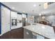 Bright kitchen features a large granite island, stainless steel appliances, and hardwood floors at 1284 Independence St, Fort Mill, SC 29708