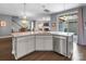 Open kitchen with stainless steel appliances, granite counters, and breakfast bar overlooking living areas at 1284 Independence St, Fort Mill, SC 29708
