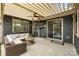Inviting covered patio with comfortable seating, a ceiling fan, and string lights creating a cozy outdoor space at 1284 Independence St, Fort Mill, SC 29708