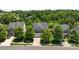 Beautiful aerial view of a two-story home with a well-manicured lawn and mature trees at 1300 Yellow Springs Dr, Indian Land, SC 29707