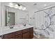 Bathroom with double sink vanity, a large mirror, and a toilet behind a shower curtain at 1300 Yellow Springs Dr, Indian Land, SC 29707