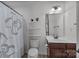 Clean bathroom featuring a vanity with storage, toilet, shelving, and shower with a curtain at 1300 Yellow Springs Dr, Indian Land, SC 29707