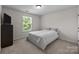 Simple bedroom with a neutral color scheme, a comfortable bed, and natural light at 1300 Yellow Springs Dr, Indian Land, SC 29707