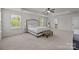 Bright bedroom boasts tray ceiling, ceiling fan, and ample windows for lots of light at 1300 Yellow Springs Dr, Indian Land, SC 29707