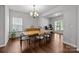 Dining room with hardwood floors, chandelier, and natural light, perfect for Gathering meals at 1300 Yellow Springs Dr, Indian Land, SC 29707