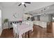 Bright dining room featuring a dining table, chandelier, and a seamless transition to the well-equipped kitchen at 1300 Yellow Springs Dr, Indian Land, SC 29707