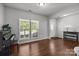Open living area with hardwood floors, large window, and a view of the front door and entryway at 1300 Yellow Springs Dr, Indian Land, SC 29707