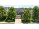 Charming two-story home featuring a two-car garage, well-maintained lawn, and mature landscaping at 1300 Yellow Springs Dr, Indian Land, SC 29707
