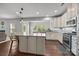 Modern kitchen with granite countertops, stainless steel appliances, and a spacious island with bar seating at 1300 Yellow Springs Dr, Indian Land, SC 29707