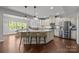 Spacious kitchen with hardwood floors, stainless steel appliances, granite countertops, and a cozy breakfast nook at 1300 Yellow Springs Dr, Indian Land, SC 29707
