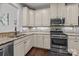 Well-appointed kitchen with stainless steel appliances, granite countertops, and mosaic tile backsplash at 1300 Yellow Springs Dr, Indian Land, SC 29707