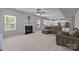 Bright open-concept living area showcasing a fireplace and an adjacent modern kitchen at 1300 Yellow Springs Dr, Indian Land, SC 29707