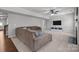 Cozy living room with plush seating, ceiling fan, and neutral carpeting at 1300 Yellow Springs Dr, Indian Land, SC 29707