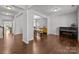 Spacious living room featuring dark wood floors, piano and gray paint at 1300 Yellow Springs Dr, Indian Land, SC 29707