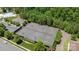 An aerial view of the community's well-maintained tennis courts surrounded by lush greenery at 1300 Yellow Springs Dr, Indian Land, SC 29707