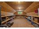 Spacious attic with built-in shelving, wood paneling, and natural light; ready for storage or conversion at 1433 Kern Carlton Rd, Salisbury, NC 28146