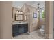 A cozy bathroom with a decorative light fixture, vanity and toilet at 1433 Kern Carlton Rd, Salisbury, NC 28146