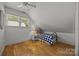 Cozy bedroom featuring hardwood floors, white walls, and a comfortable twin bed at 1433 Kern Carlton Rd, Salisbury, NC 28146